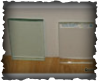 A photo showing the visual difference between regular glass and low-iron glass, the low-iron glass is noticeably clearer