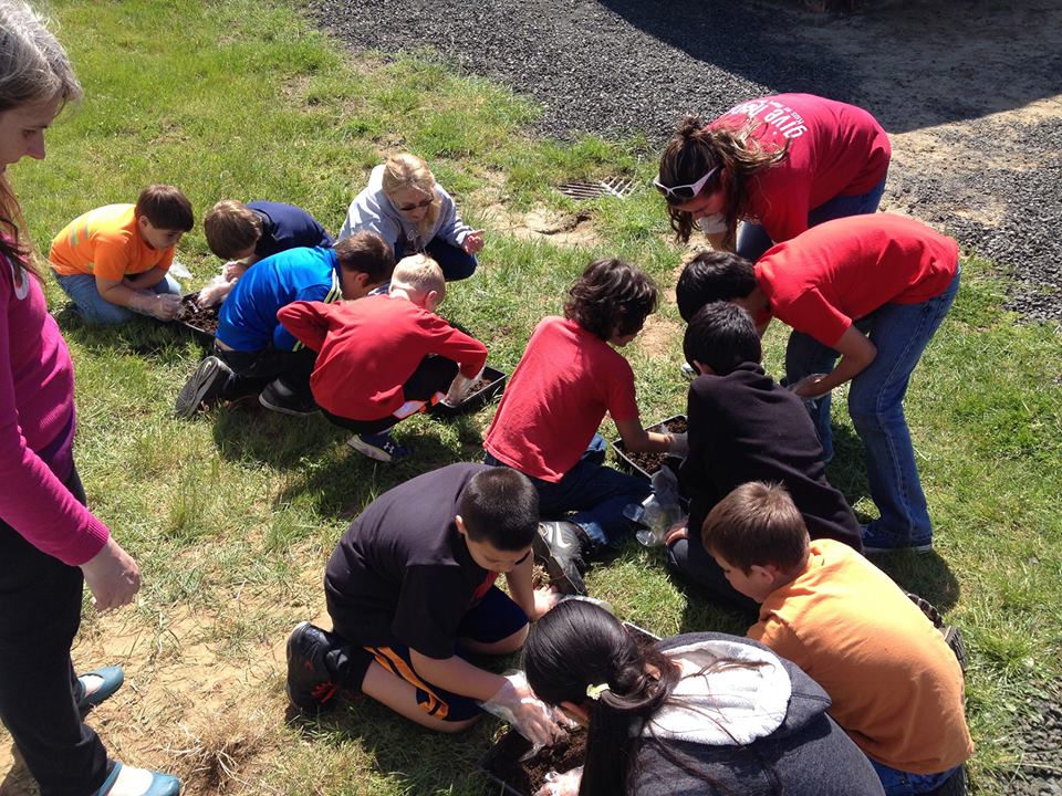 Photo of Ocosta Students looking at fish bones outside